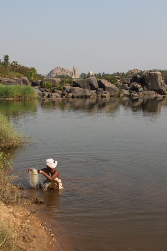 Fishing in the swimming pond.